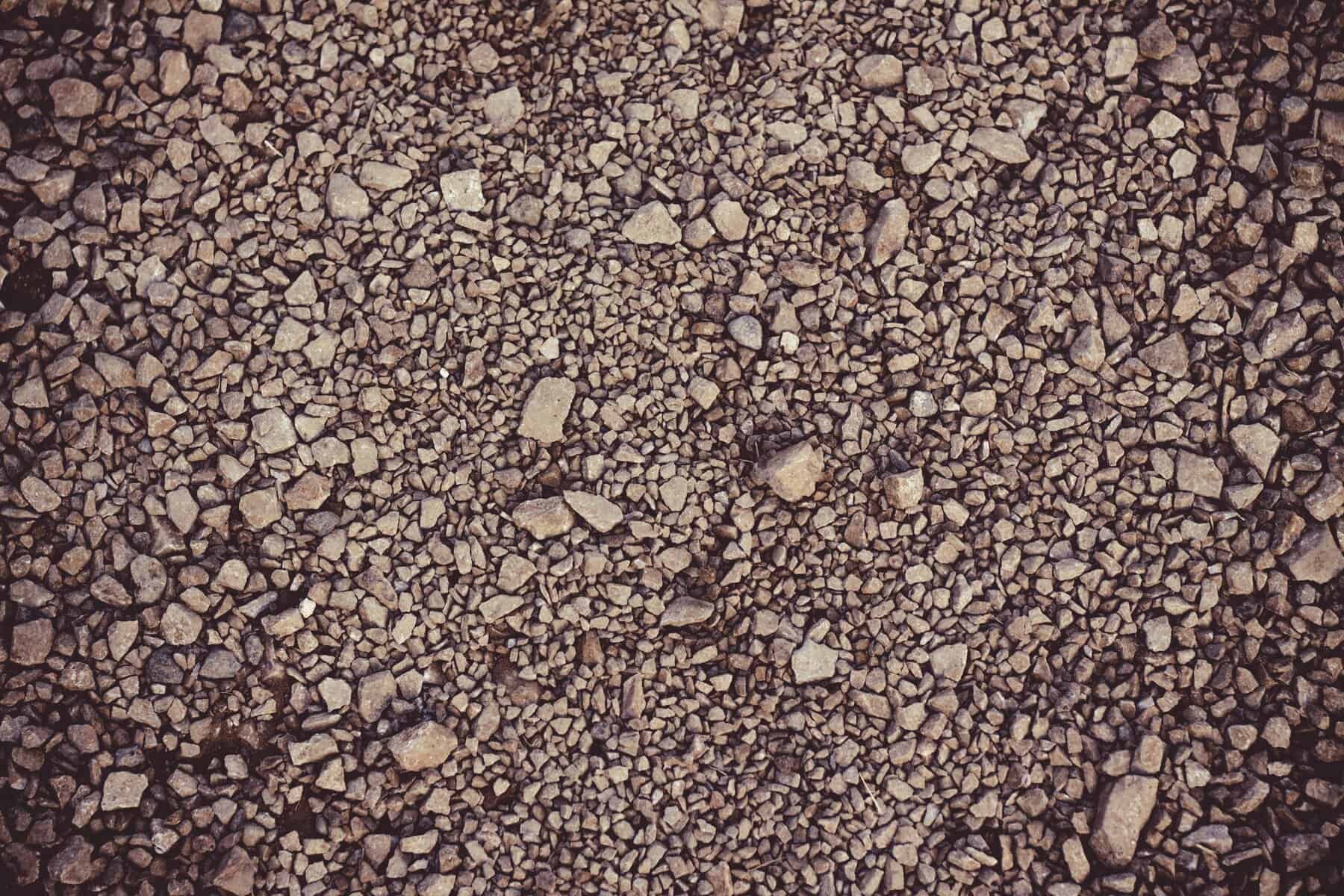 Close-up of gravel surface with small stones, used for pathways and landscaping features at West-Hodson.